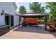 Enjoy outdoor living on the wooden deck with a gazebo and red cushioned furniture at 135 Primrose Dr, Salisbury, NC 28147
