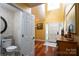 View of front door, side powder room and foyer with hardwood flooring at 135 Primrose Dr, Salisbury, NC 28147
