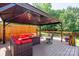 An inviting outdoor gazebo with comfortable seating on backyard deck at 135 Primrose Dr, Salisbury, NC 28147