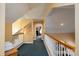 Bright, carpeted hallway with white railings and view into a bedroom at 135 Primrose Dr, Salisbury, NC 28147