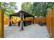 Hot tub is set on a paved patio underneath a gazebo at 135 Primrose Dr, Salisbury, NC 28147