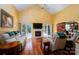 Bright living room with a fireplace, sliding glass doors, and hardwood floors at 135 Primrose Dr, Salisbury, NC 28147