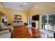 Comfortable living room featuring a fireplace, sliding glass doors, and hardwood floors at 135 Primrose Dr, Salisbury, NC 28147