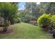 Well-maintained backyard features lush lawn and mature trees, perfect for outdoor activities at 140 Quiet Cove Rd, Mooresville, NC 28117