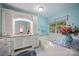Light blue bathroom with garden tub, white vanity, and granite countertop at 140 Quiet Cove Rd, Mooresville, NC 28117