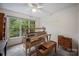 Bright room featuring a crafting machine, a large window with outdoor views, and carpeted floors at 140 Quiet Cove Rd, Mooresville, NC 28117