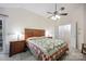 Bright bedroom featuring ceiling fan, neutral walls, and craftsman style furnishings at 140 Quiet Cove Rd, Mooresville, NC 28117