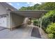 Carport and driveway showcasing access to a private gated entrance at 140 Quiet Cove Rd, Mooresville, NC 28117