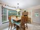 Inviting eat-in kitchen featuring a wooden table, a window view and natural light at 140 Quiet Cove Rd, Mooresville, NC 28117
