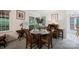 Bright dining room with hardwood table, chair seating, and sliding doors at 140 Quiet Cove Rd, Mooresville, NC 28117