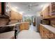 Open-concept kitchen with stainless steel appliances, light wood cabinets, tile backsplash, and view to dining area at 140 Quiet Cove Rd, Mooresville, NC 28117