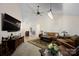 Open-concept living room showcasing neutral walls, a television, and views into the dining area at 140 Quiet Cove Rd, Mooresville, NC 28117