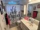 Bathroom featuring vanity, toilet and shower with black and white patterned shower curtain at 148 W Walnut Ave, Mount Holly, NC 28120