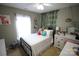 Bedroom featuring bright light and comfortable bed at 148 W Walnut Ave, Mount Holly, NC 28120
