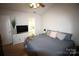 Bedroom with natural light, neutral walls and TV at 148 W Walnut Ave, Mount Holly, NC 28120