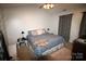 Bedroom featuring a ceiling fan, soft carpet, and neutral-toned walls at 148 W Walnut Ave, Mount Holly, NC 28120