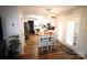 Open kitchen with an island and breakfast bar that leads to outdoor access at 148 W Walnut Ave, Mount Holly, NC 28120