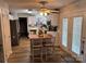 Bright kitchen with island, white cabinets, and wood-look flooring at 148 W Walnut Ave, Mount Holly, NC 28120