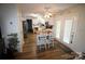 Bright kitchen with island, white cabinets, and wood-look flooring at 148 W Walnut Ave, Mount Holly, NC 28120