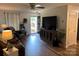 Cozy living room area with wood-look flooring, neutral colors, and lots of natural light at 148 W Walnut Ave, Mount Holly, NC 28120