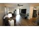 Inviting living room space with lots of natural light and wood-look flooring at 148 W Walnut Ave, Mount Holly, NC 28120