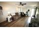 Comfortable living room area with fireplace, lots of natural light and wood-look flooring at 148 W Walnut Ave, Mount Holly, NC 28120
