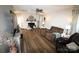 Spacious living room features a fireplace, lots of natural light and wood-look flooring at 148 W Walnut Ave, Mount Holly, NC 28120