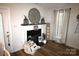 Cozy living room with fireplace and decor, showcasing a welcoming atmosphere at 148 W Walnut Ave, Mount Holly, NC 28120