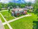 Expansive lawn surrounds a beautiful home with mature landscaping and a brick exterior at 15 Kings Mountain St, York, SC 29745