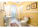 Charming bathroom with bright tilework, vintage fixtures and separate shower at 15 Kings Mountain St, York, SC 29745