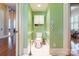 Powder room featuring white tile floors, grab bars, and a storage cabinet at 15 Kings Mountain St, York, SC 29745