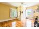 Inviting bedroom featuring gleaming hardwood floors and sunny, shuttered windows at 15 Kings Mountain St, York, SC 29745