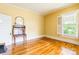 Bedroom showcasing hardwood floors, and ample light from shuttered windows at 15 Kings Mountain St, York, SC 29745