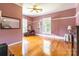 Spacious bedroom features hardwood floors, vintage vanity, and classic shutters at 15 Kings Mountain St, York, SC 29745