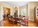 Elegant dining room featuring beautiful hardwood floors, chandelier, and abundant natural light at 15 Kings Mountain St, York, SC 29745