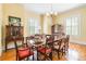 Formal dining room with chandelier lighting and hardwood floors, perfect for entertaining at 15 Kings Mountain St, York, SC 29745