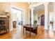 Welcoming entryway with hardwood floors, decorative columns, and views into adjoining rooms at 15 Kings Mountain St, York, SC 29745