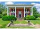 Elegant brick home with white columns, a manicured lawn, and classic architectural details at 15 Kings Mountain St, York, SC 29745
