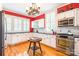 Cozy kitchen with white cabinets, stainless steel appliances, and hardwood flooring at 15 Kings Mountain St, York, SC 29745