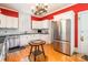 Lovely kitchen showcasing stainless steel appliances, white cabinets, and great natural light at 15 Kings Mountain St, York, SC 29745