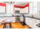 Well-lit kitchen features stainless appliances, marble backsplash, and ample counter space at 15 Kings Mountain St, York, SC 29745