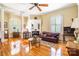 Spacious living room features hardwood flooring, a fireplace, and plenty of windows for natural light at 15 Kings Mountain St, York, SC 29745