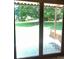 View of a lush backyard and a patio through glass doors at 1909 Normandy Rd, Kannapolis, NC 28081