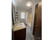 Functional bathroom with vanity sink, mirror, window, and combined shower and bathtub at 1909 Normandy Rd, Kannapolis, NC 28081