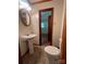 Cozy bathroom featuring a pedestal sink and toilet at 1909 Normandy Rd, Kannapolis, NC 28081