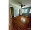 Inviting bedroom featuring hardwood floors, a ceiling fan, and ample closet space at 1909 Normandy Rd, Kannapolis, NC 28081