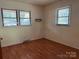 Bright bedroom with two windows and neutral walls at 1909 Normandy Rd, Kannapolis, NC 28081