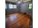 Bedroom boasts gleaming hardwood floors, natural light from two windows, and ample space at 1909 Normandy Rd, Kannapolis, NC 28081