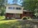 Charming two-story home with a manicured lawn and mature trees offering great curb appeal at 1909 Normandy Rd, Kannapolis, NC 28081