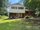 Charming two-story home with a manicured lawn and mature trees offering great curb appeal at 1909 Normandy Rd, Kannapolis, NC 28081